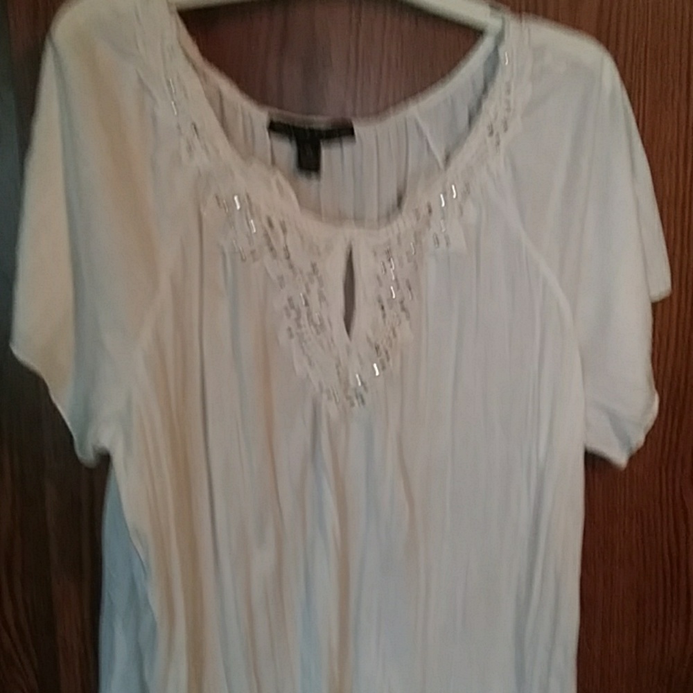 Beautiful white top with beading around front